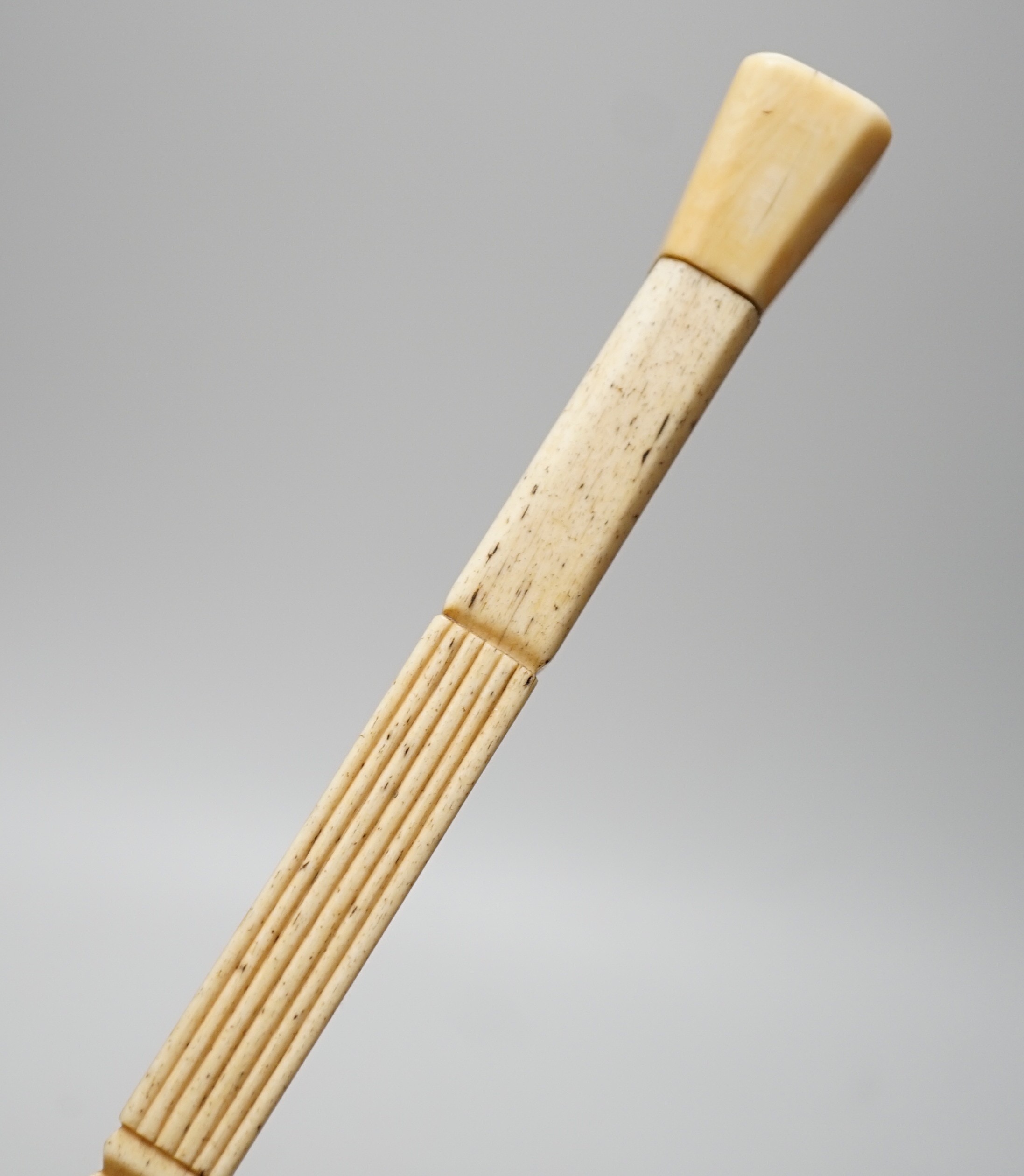 An early 19th century carved scrimshaw whalebone walking cane, 93cms